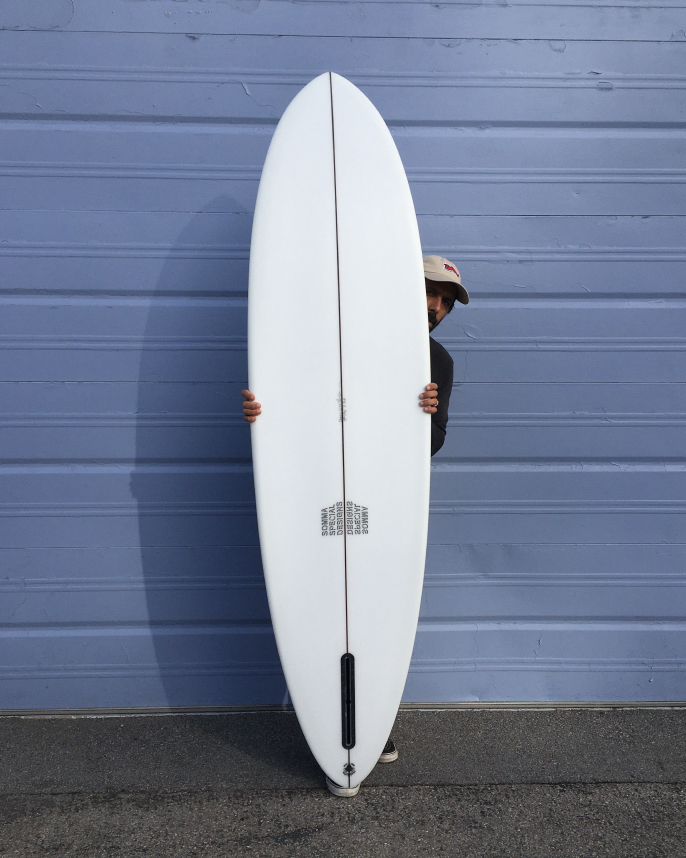 Custom midlength hand shaped surfboard by shaper Shea Somma of Central California.
