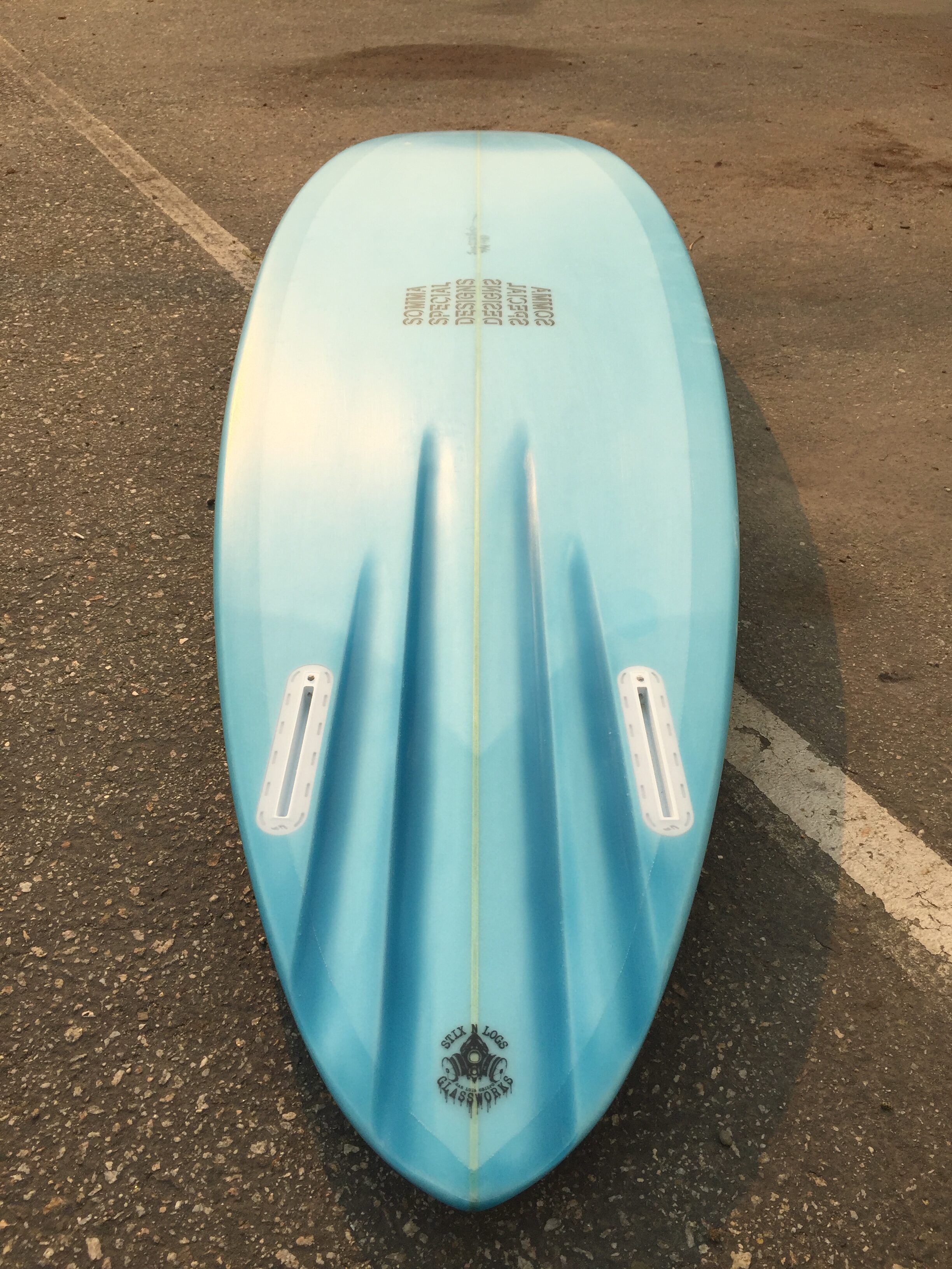 Hand shaped custom channel bottom twin fin surfboard by shaper Shea Somma of San Luis Obispo California