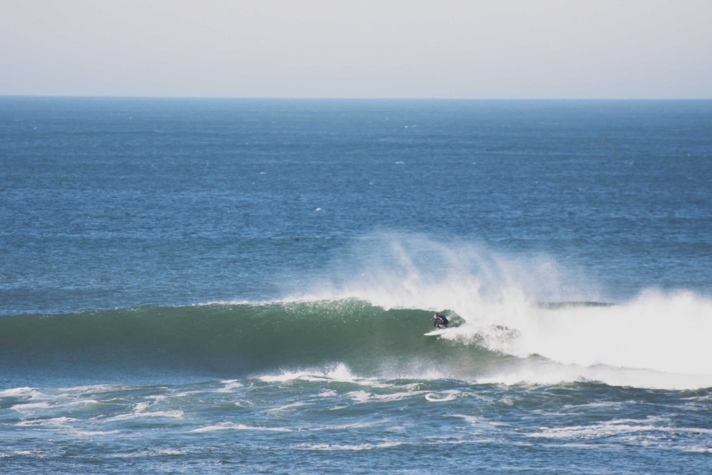 August Kreowski surfing a custom hand shaped midlength surfboard by Shea Somma at Ocean Beach San Francisco